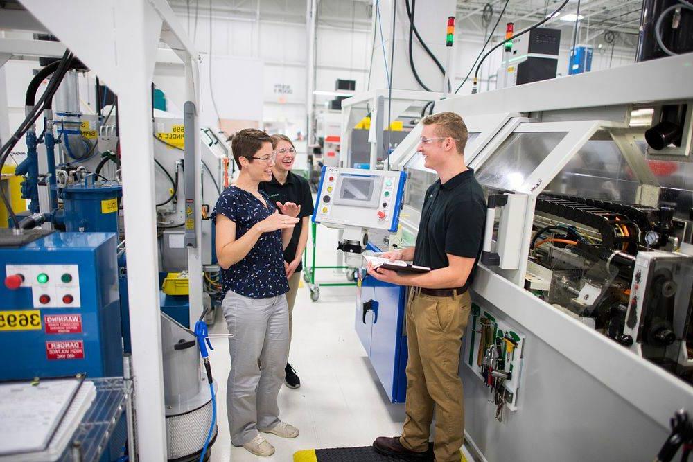 GVSU engineering professor working with a student at their co-op.